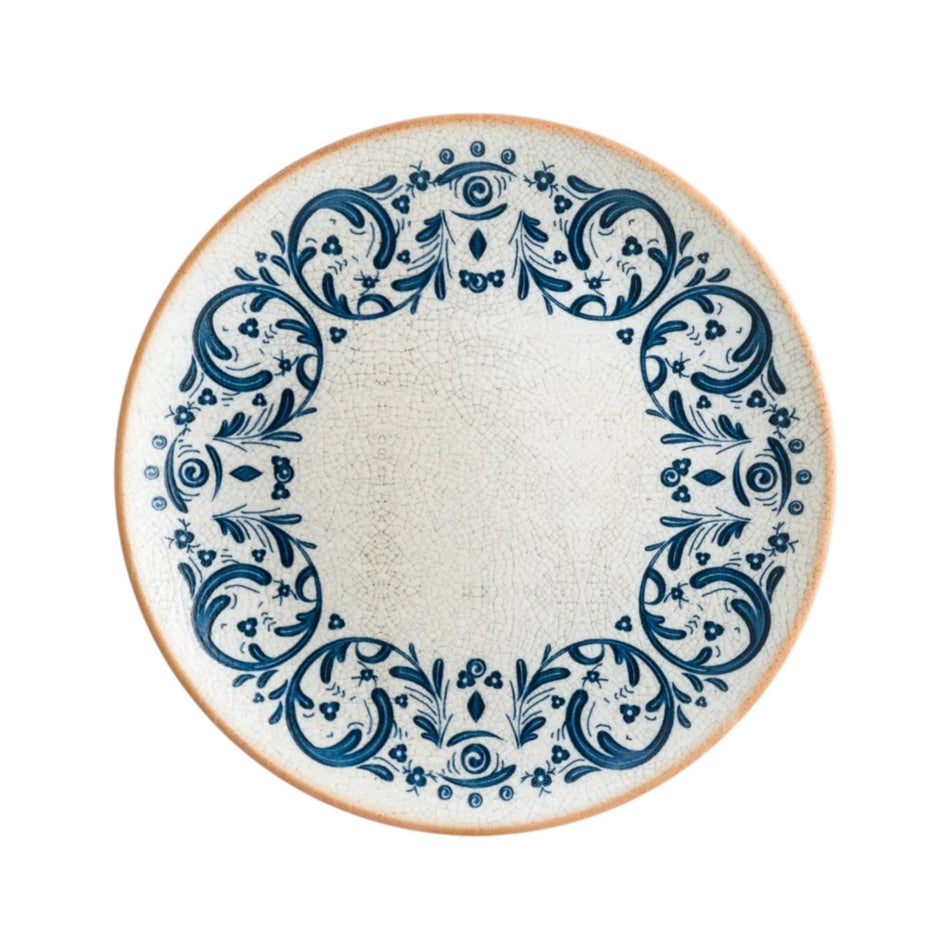 Plato trinche Viento Gourmet 27 cm con decorado azul sobre fondo crema, vista superior